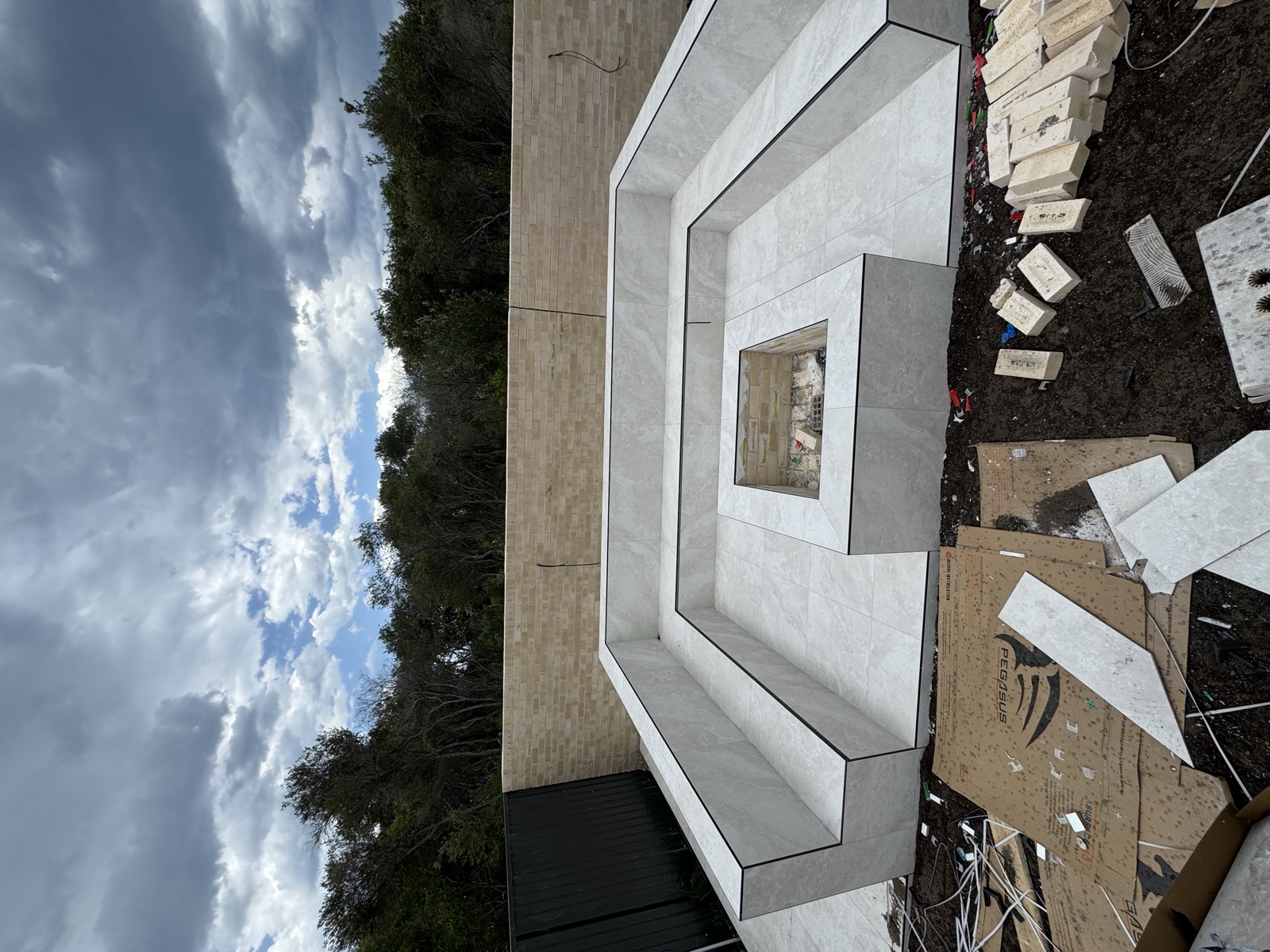 Exterior stone-look tiled steps and fireplace surround, Rong Xiang Tilers