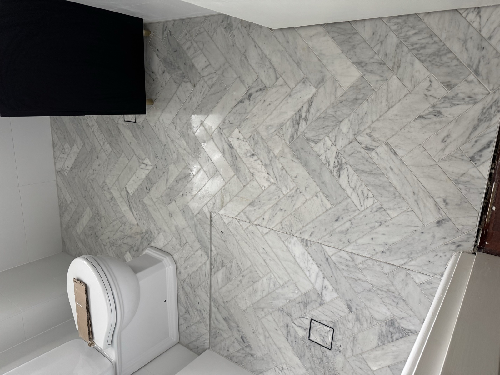Herringbone marble floor tiling in bathroom, Rong Xiang Tilers