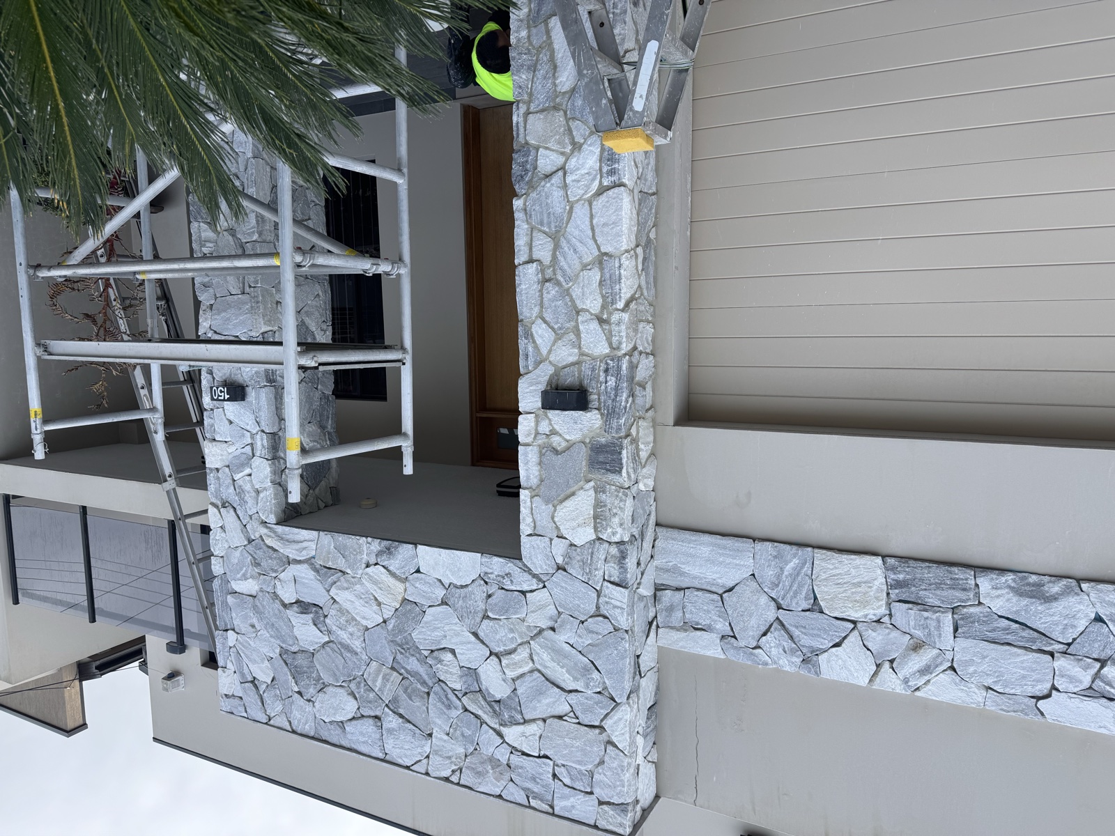 Natural stone cladding on exterior columns, Rong Xiang Tilers